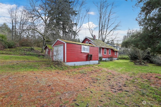 exterior space featuring an outbuilding and a yard