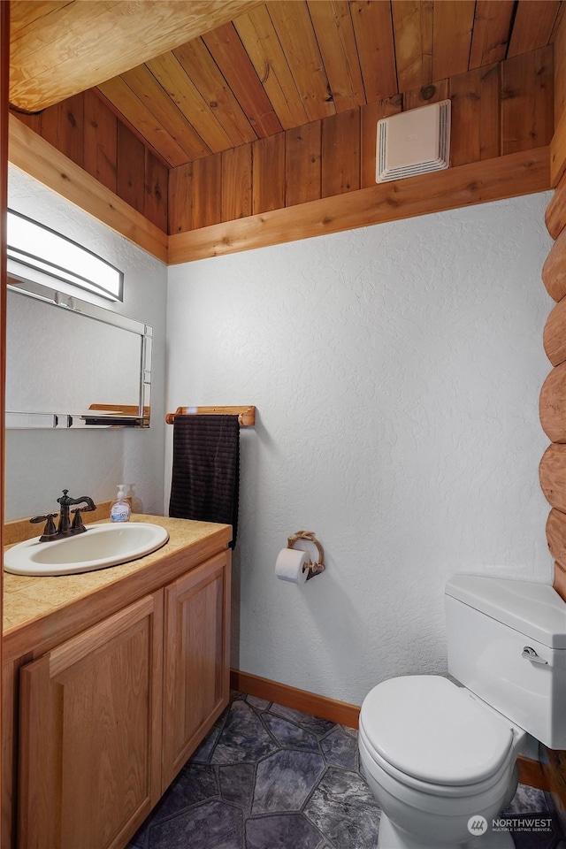 bathroom with vanity, toilet, and wooden ceiling