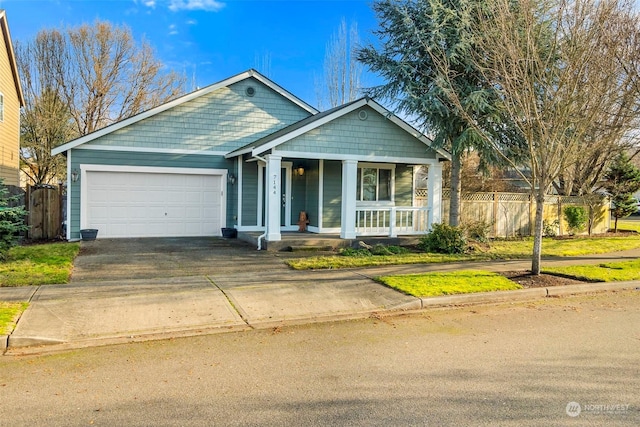 view of front of home with a porch and a garage