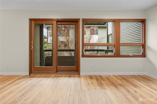 entryway with light hardwood / wood-style flooring