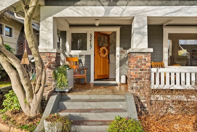 property entrance featuring covered porch