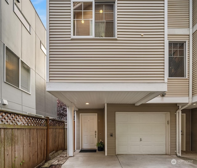 view of side of home featuring a garage