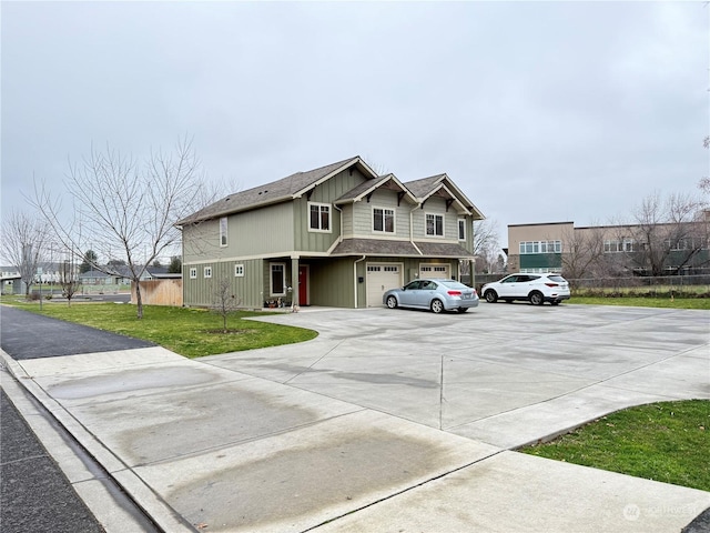 view of front of house with a front yard and a garage