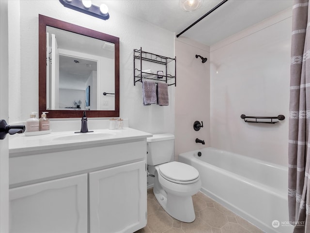 full bathroom with tile patterned flooring, shower / bath combo with shower curtain, vanity, and toilet