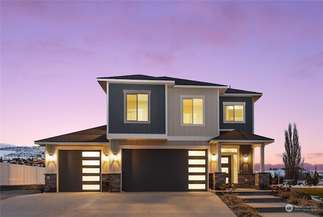 view of front facade with a mountain view and a garage