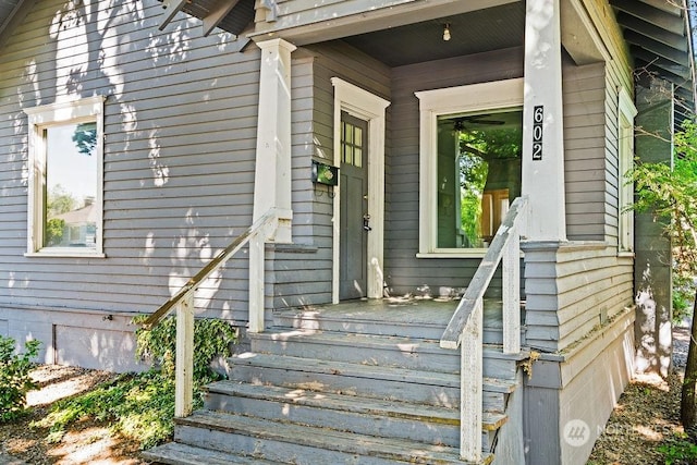 entrance to property featuring a porch