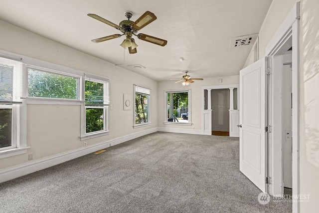 carpeted spare room with ceiling fan and a healthy amount of sunlight