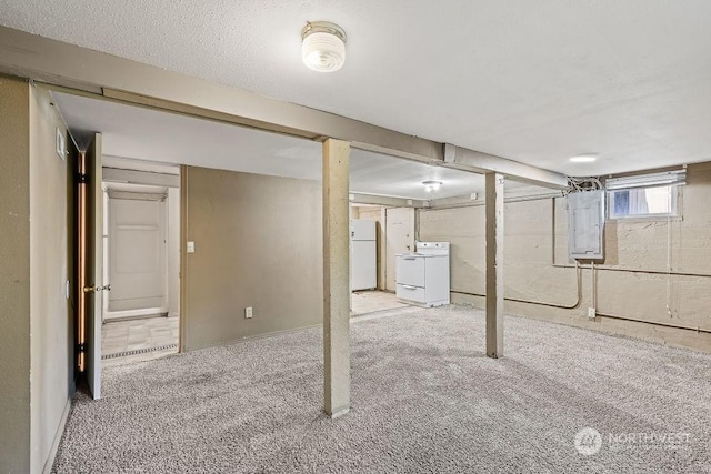 basement with electric panel, light carpet, and white refrigerator