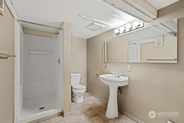 bathroom featuring a shower and toilet