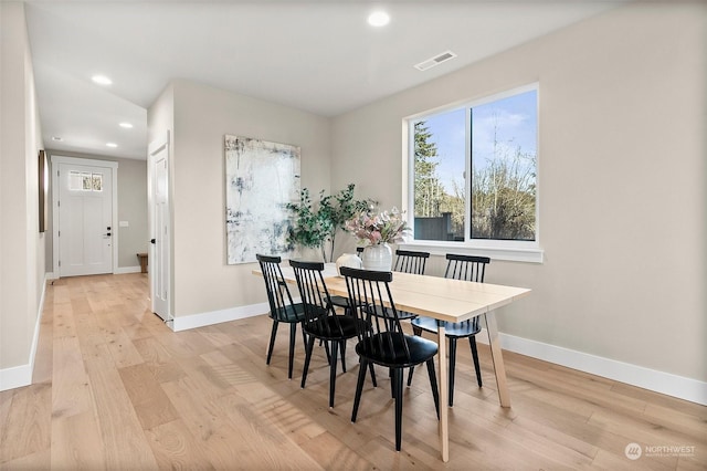 dining space featuring light hardwood / wood-style flooring