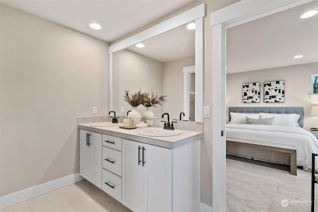 bathroom with vanity and tile patterned flooring