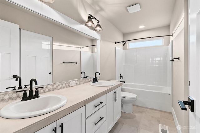 full bathroom featuring vanity, tile patterned floors, toilet, and washtub / shower combination