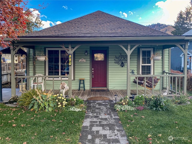 bungalow featuring a front yard and a porch