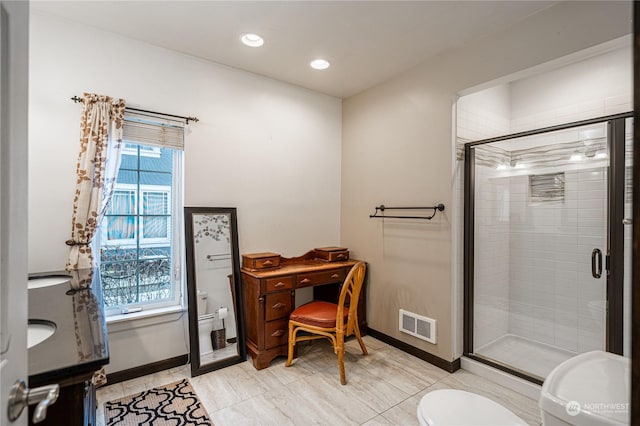 bathroom with toilet, an enclosed shower, and tile patterned floors