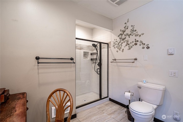 bathroom with toilet, tile patterned flooring, and walk in shower