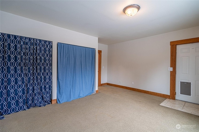 unfurnished room featuring carpet