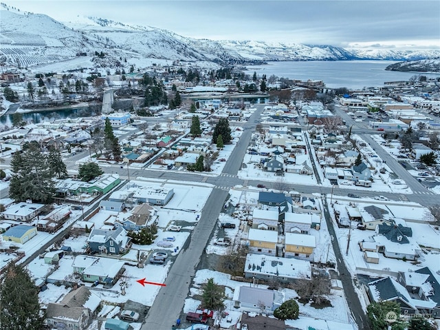 snowy aerial view with a mountain view