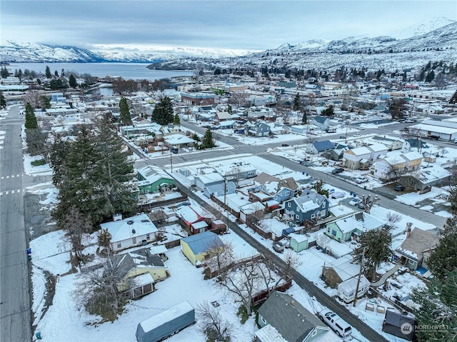 snowy aerial view with a mountain view