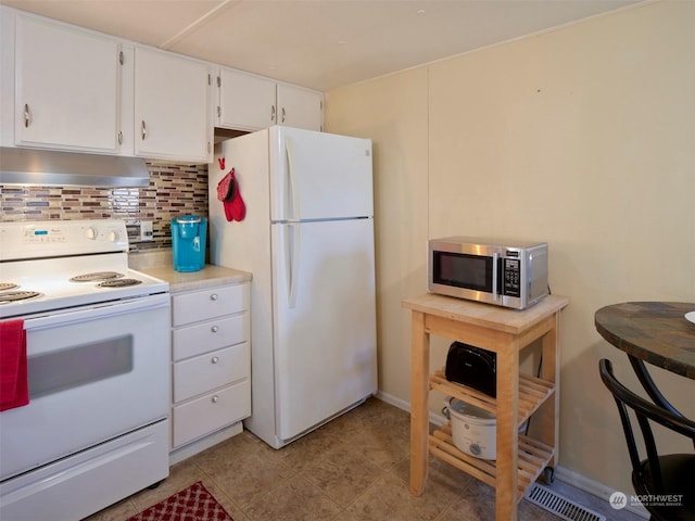 kitchen with white cabinets, white appliances, and backsplash