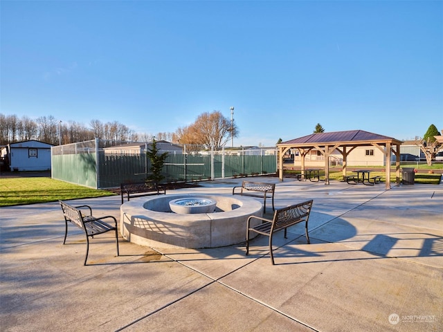 view of patio / terrace featuring a gazebo and a fire pit