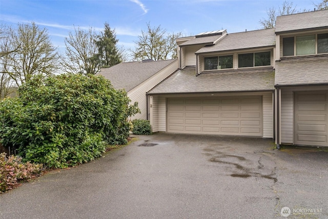 garage featuring driveway