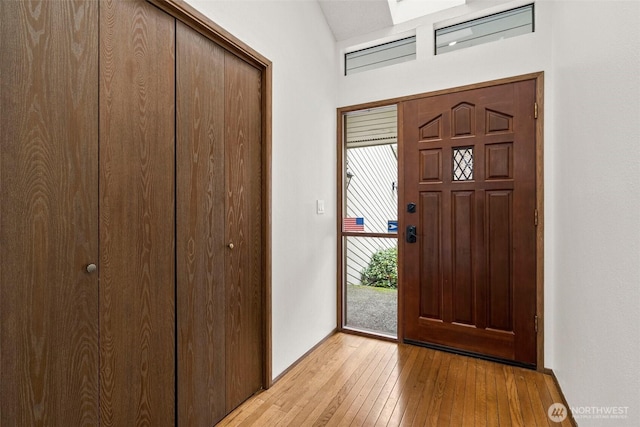 entryway with light wood-style floors