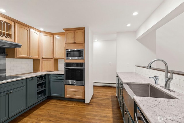 kitchen featuring light stone counters, dark wood finished floors, appliances with stainless steel finishes, beverage cooler, and exhaust hood