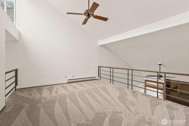 bonus room with lofted ceiling, carpet, baseboard heating, and a wealth of natural light