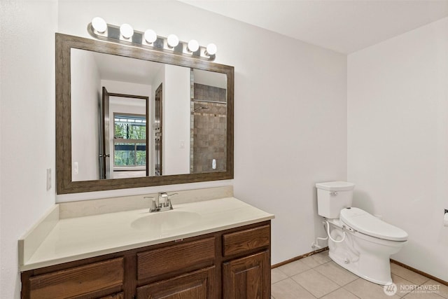 bathroom with baseboards, a shower with shower curtain, toilet, tile patterned flooring, and vanity