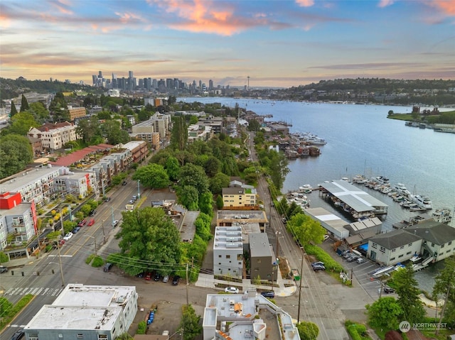 aerial view at dusk with a water view