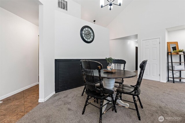 6807 345th St S, Roy, WA 98580 - carpeted dining room with visible vents, baseboards, and high vaulted ceiling