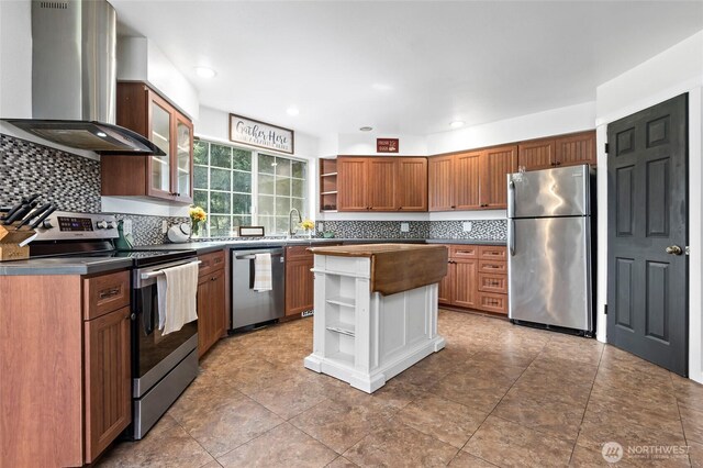 6807 345th St S, Roy, WA 98580 - kitchen with open shelves, backsplash, appliances with stainless steel finishes, and wall chimney exhaust hood