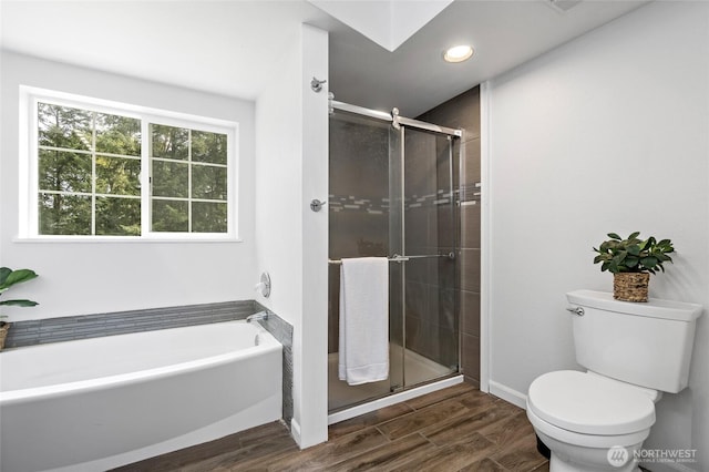 6807 345th St S, Roy, WA 98580 - bathroom featuring a garden tub, wood finish floors, a shower stall, recessed lighting, and toilet