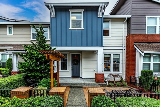 view of front of property with a pergola