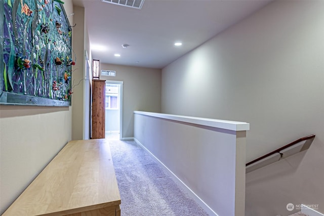 hallway featuring carpet floors