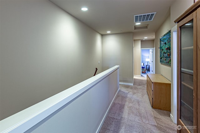 hallway with light carpet