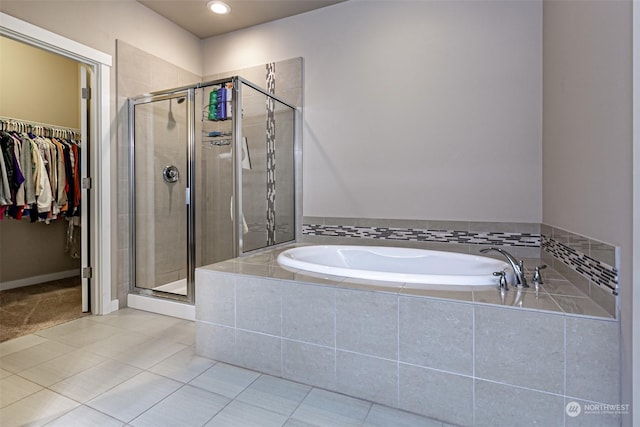 bathroom with tile patterned flooring and plus walk in shower