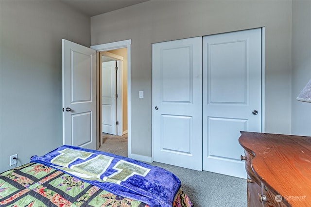 carpeted bedroom with a closet