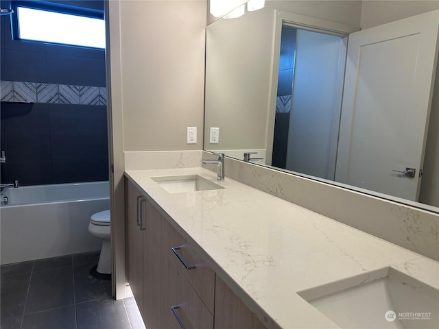 full bathroom with bathtub / shower combination, tile patterned floors, toilet, and vanity