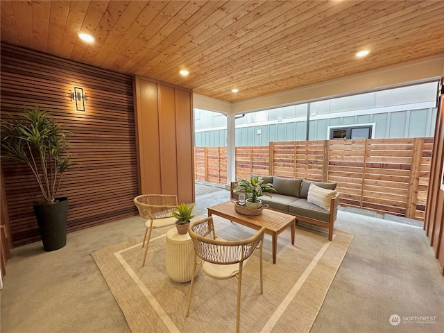 sunroom featuring wooden ceiling