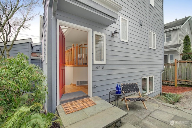 entrance to property with a patio