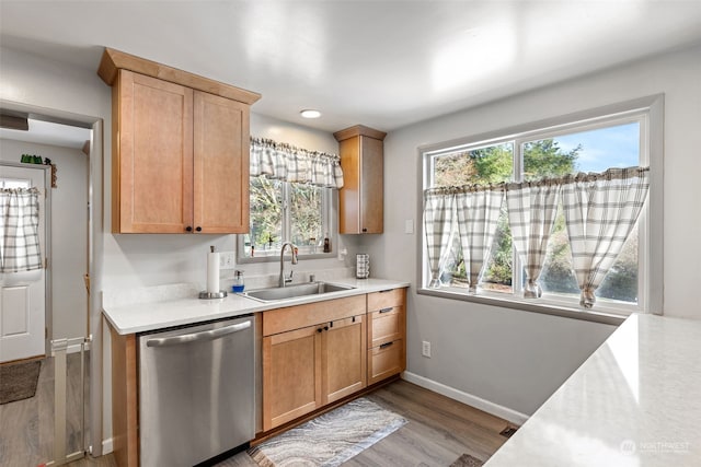 1989 NE Lisa Ln, Poulsbo, WA 98370 - kitchen featuring baseboards, dishwasher, light countertops, and a sink