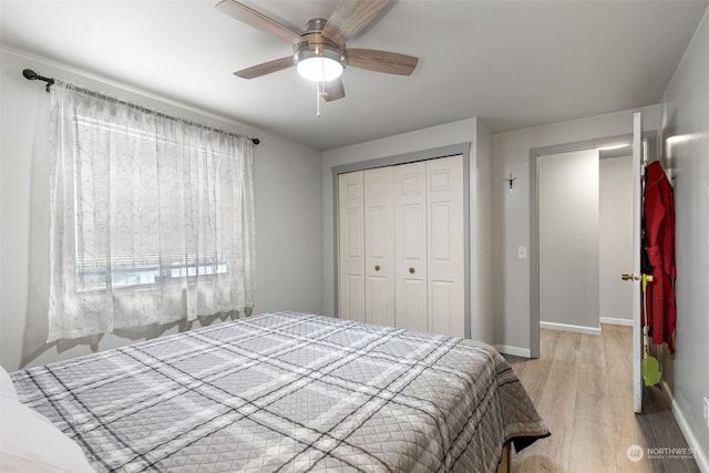 1989 NE Lisa Ln, Poulsbo, WA 98370 - bedroom featuring a closet, light wood finished floors, baseboards, and ceiling fan