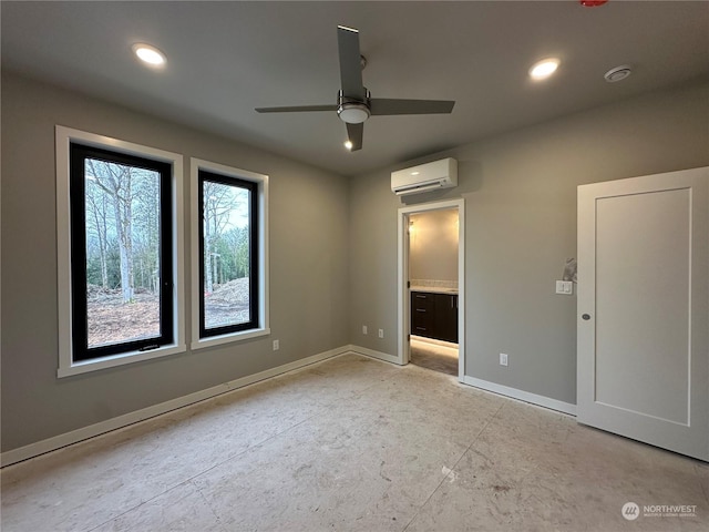 unfurnished bedroom with an AC wall unit and ceiling fan