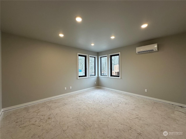 spare room with a wall mounted air conditioner