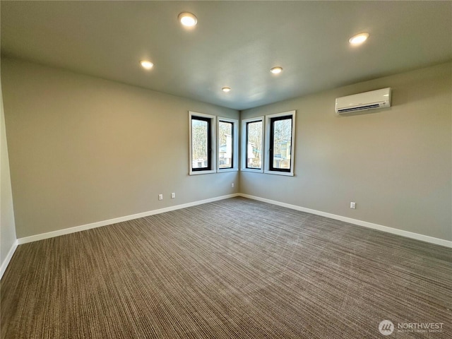 carpeted empty room featuring an AC wall unit