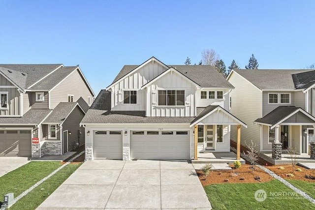 view of front of home with a garage and a front lawn