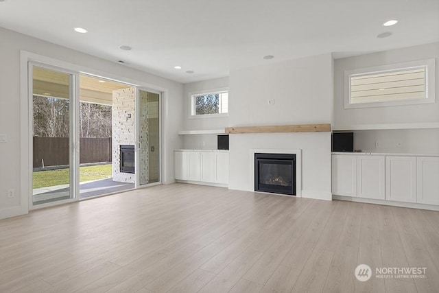 unfurnished living room with light hardwood / wood-style floors