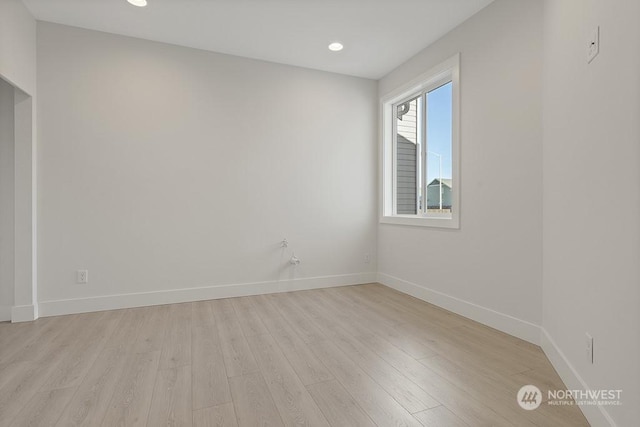 empty room with light hardwood / wood-style floors