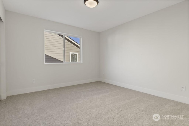 unfurnished room featuring carpet flooring